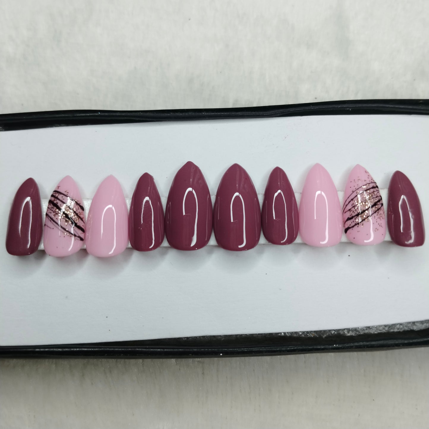 The NailzStation Glossy Pink Swirls Press on Fake Artificial Nails Set with glue, filer, sticker application kit // 1410