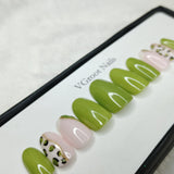 The NailzStation Glossy Light Green Animal Print Press on Fake Artificial Nails Set with glue, filer, sticker application kit // 1106