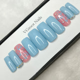 The NailzStation Glossy Light Blue Hearts Press on Fake Artificial Nails Set with glue, filer, sticker application kit // 1100