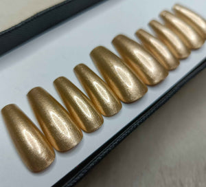 The NailzStation Gold Chrome Press on Fake Artificial Nails Set with glue, filer, sticker application kit