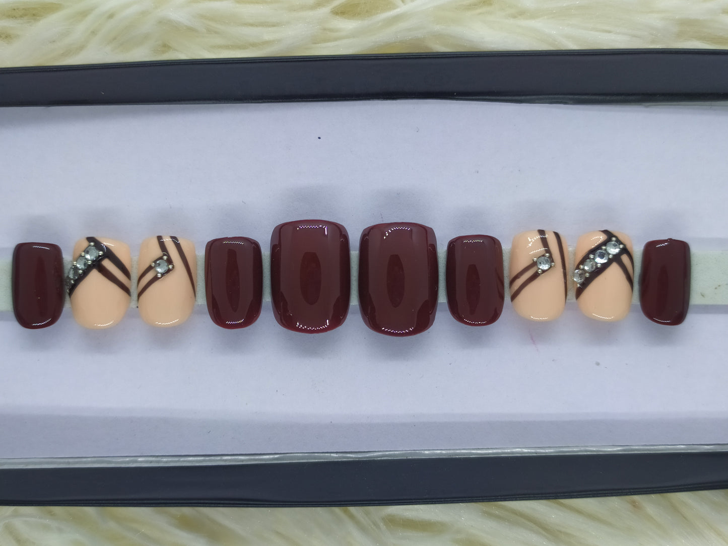 The NailzStation Glossy Maroon Studded Press on Fake Artificial Nails Set with glue, filer, sticker application kit // 1337