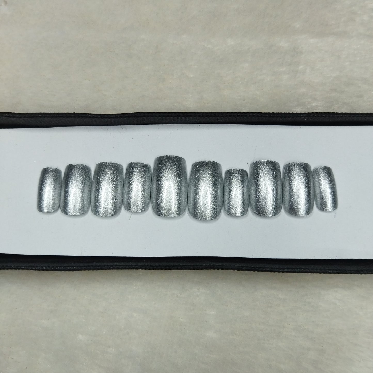 The NailzStation Glossy Silver Press on Fake Artificial Nails Set with glue, filer, sticker application kit // 1278