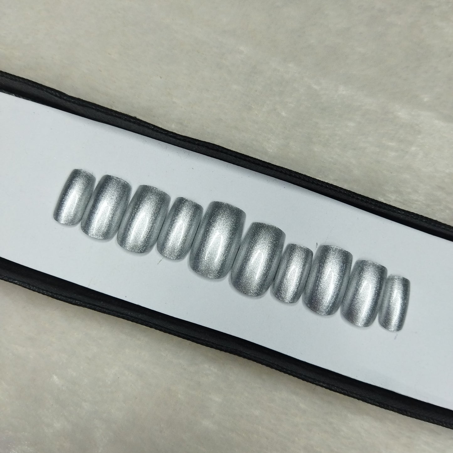 The NailzStation Glossy Silver Press on Fake Artificial Nails Set with glue, filer, sticker application kit // 1278