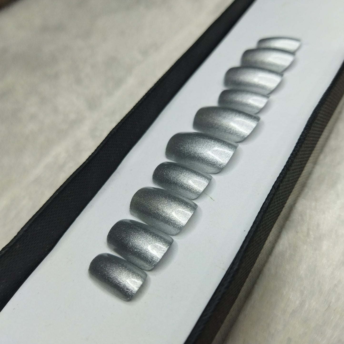 The NailzStation Glossy Silver Press on Fake Artificial Nails Set with glue, filer, sticker application kit // 1278