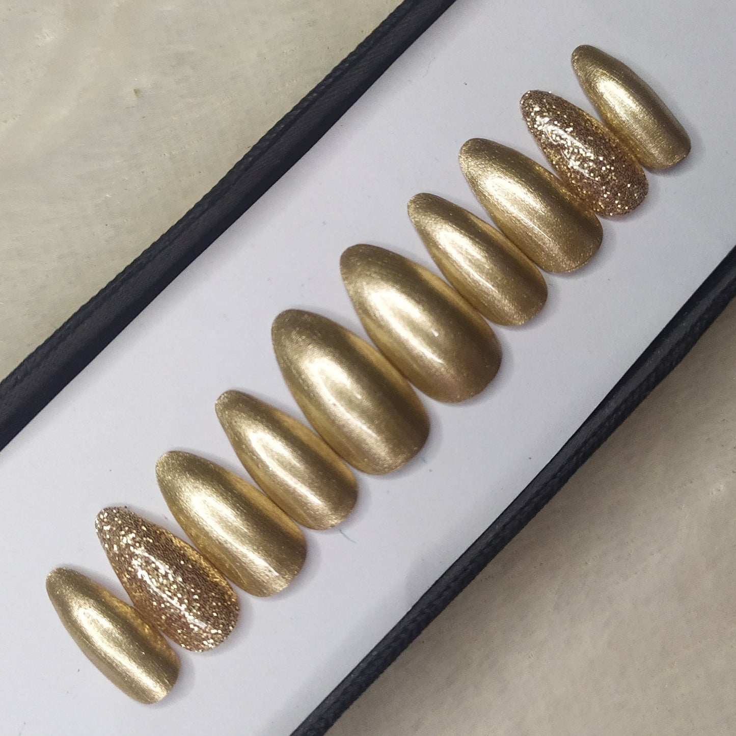 The NailzStation Glossy Golden Glitter Press on Fake Artificial Nails Set with glue, filer, sticker application kit // 1312