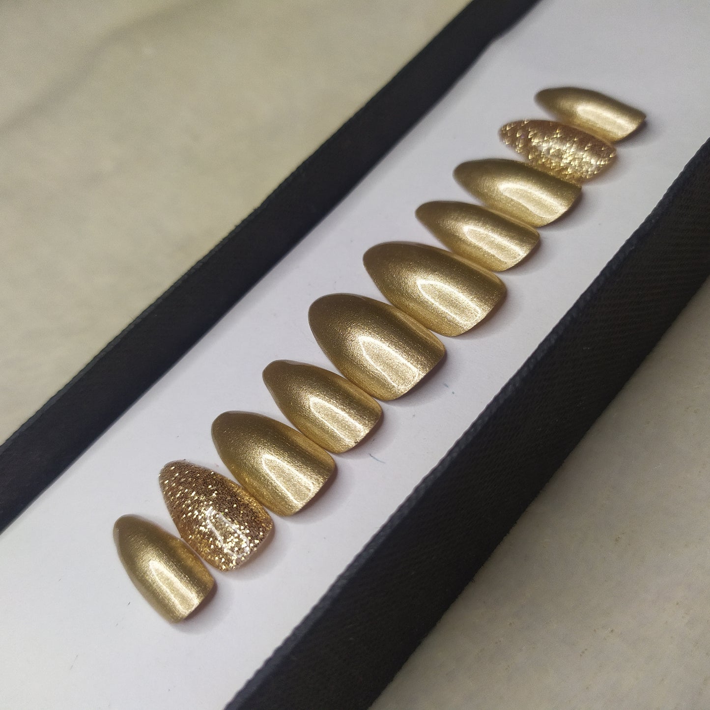 The NailzStation Glossy Golden Glitter Press on Fake Artificial Nails Set with glue, filer, sticker application kit // 1312