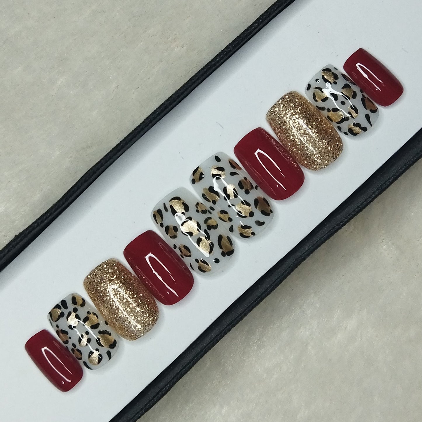 The NailzStation Glossy Red Animal Print Press on Fake Artificial Nails Set with glue, filer, sticker application kit // 1311