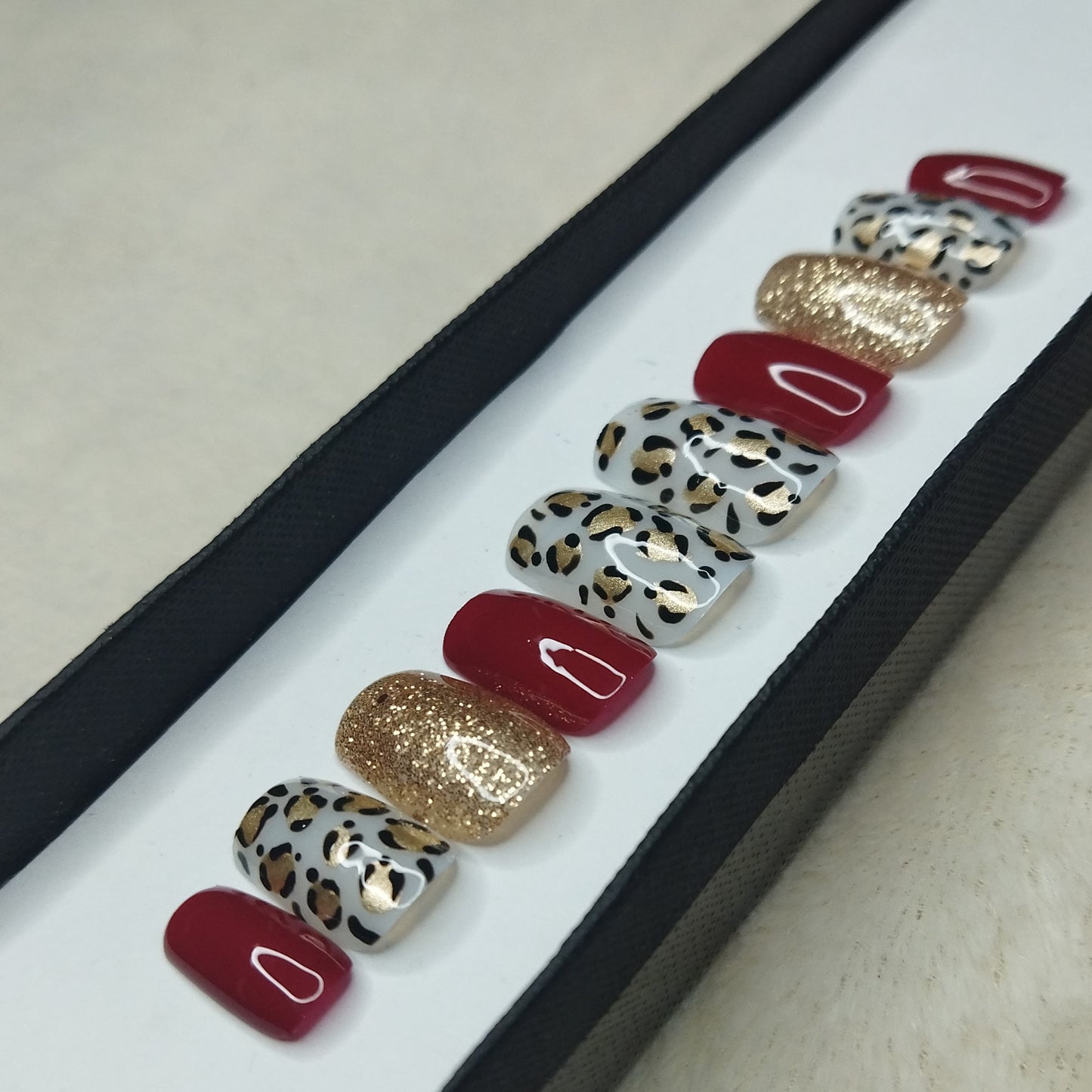 The NailzStation Glossy Red Animal Print Press on Fake Artificial Nails Set with glue, filer, sticker application kit // 1311