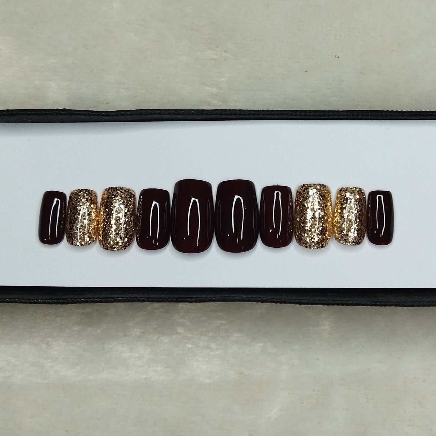 The NailzStation Glossy Dark Maroon Glitter Press on Fake Artificial Nails Set with glue, filer, sticker application kit // 1310