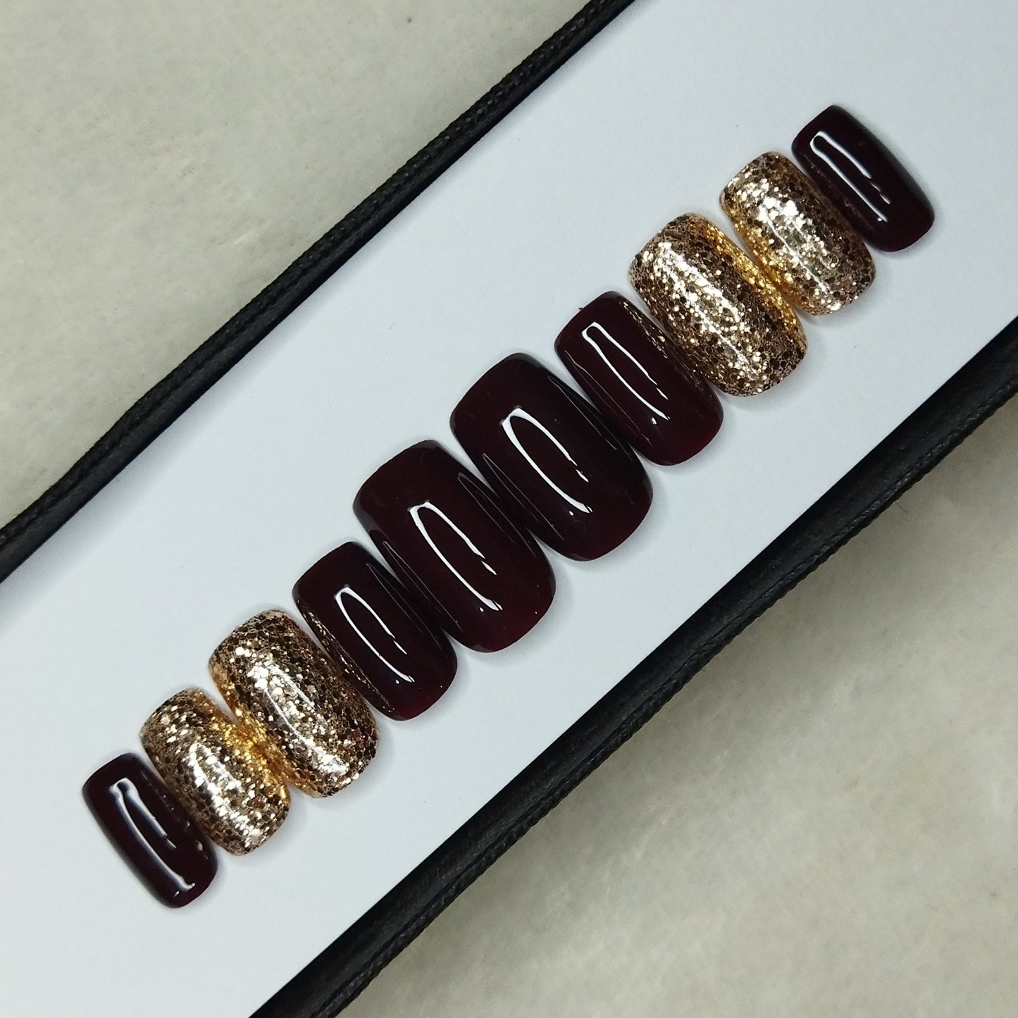 The NailzStation Glossy Dark Maroon Glitter Press on Fake Artificial Nails Set with glue, filer, sticker application kit // 1310