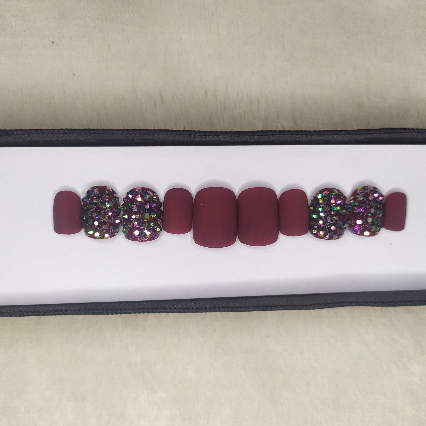 The NailzStation Glossy Maroon Studded Press on Fake Artificial Nails Set with glue, filer, sticker application kit // 1286