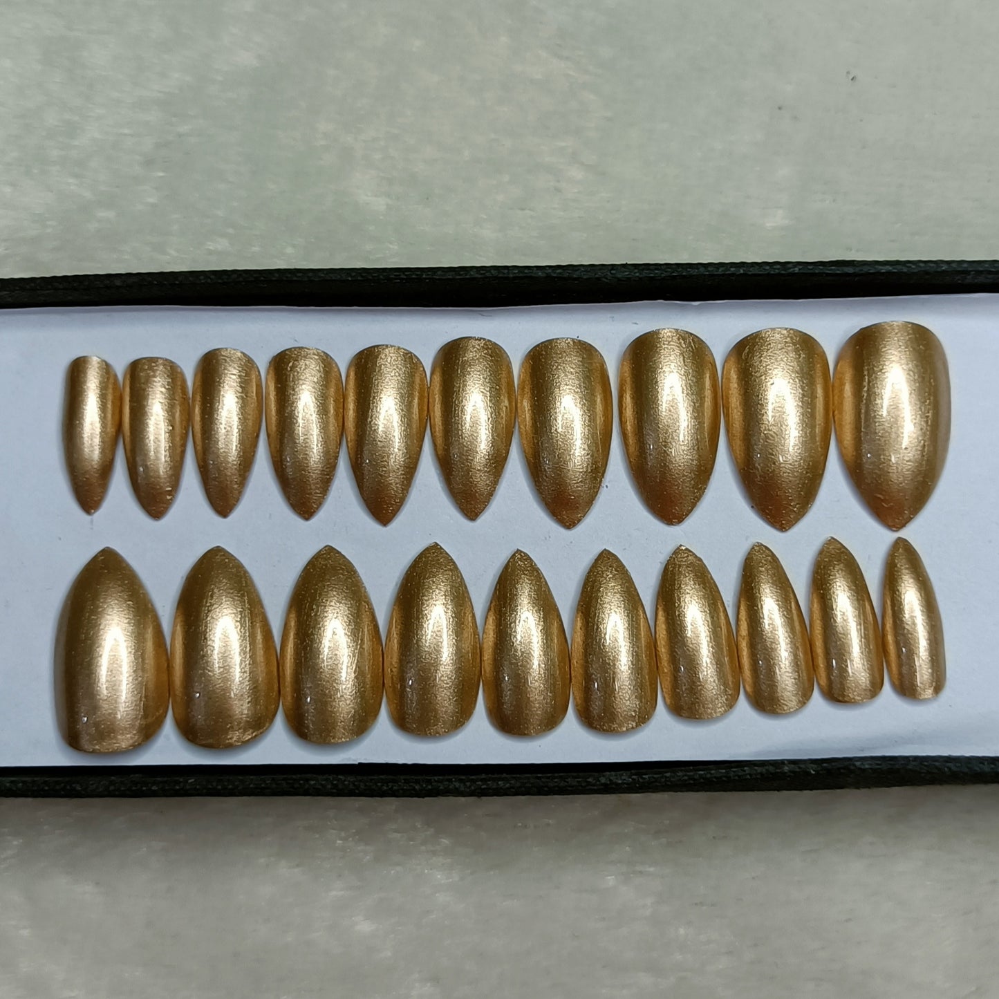 The NailzStation Glossy Golden Press on Fake Artificial Nails Set with glue, filer, sticker application kit // 1284