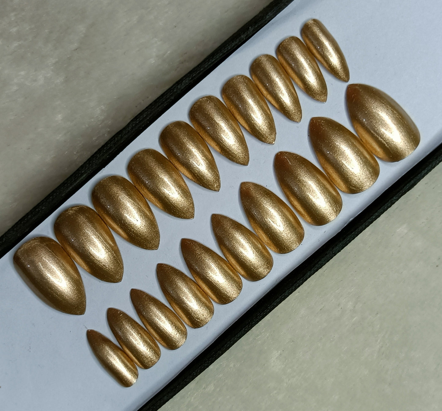 The NailzStation Glossy Golden Press on Fake Artificial Nails Set with glue, filer, sticker application kit // 1284