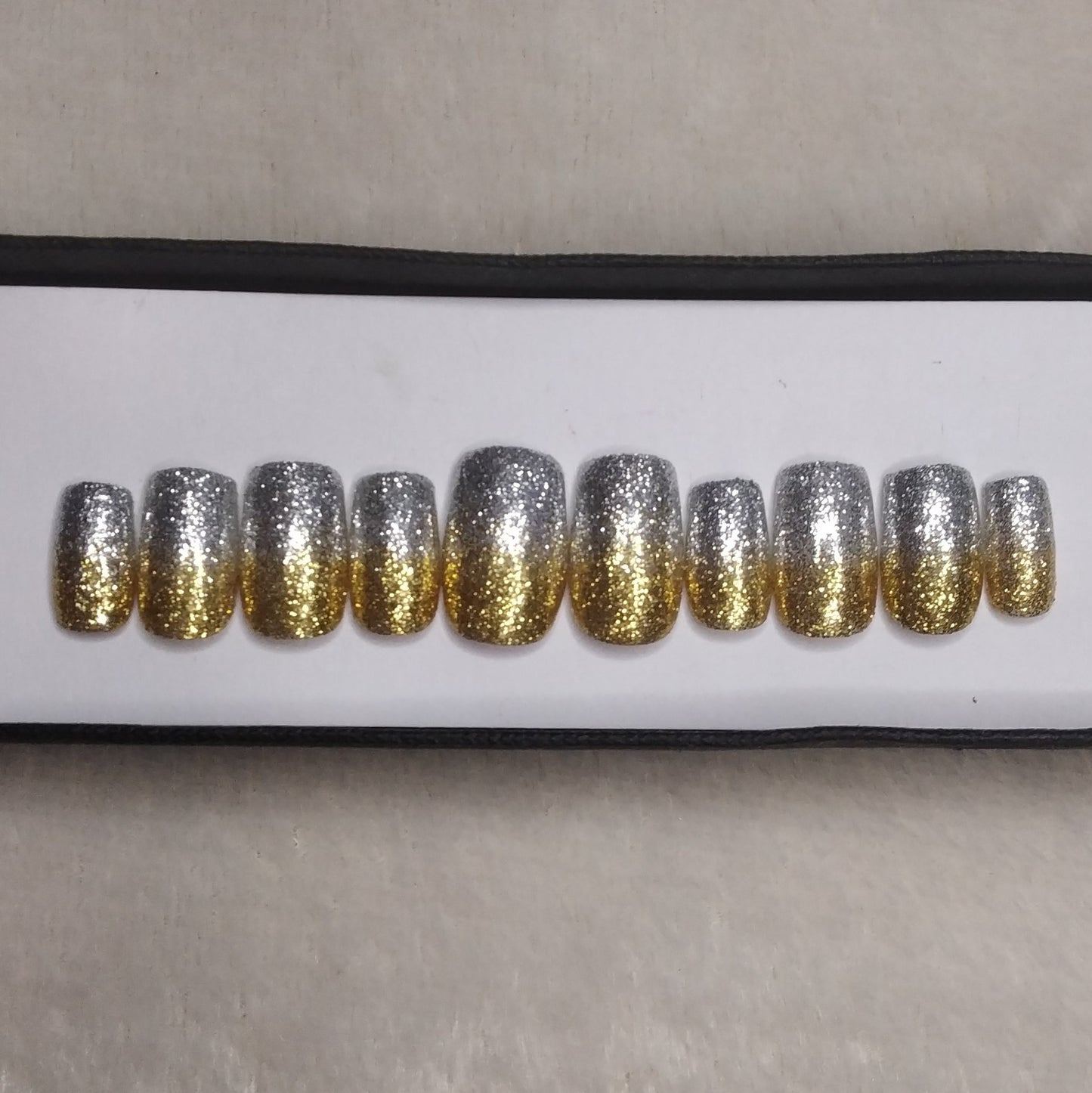 The NailzStation Glossy Silver and Golden Glitter Press on Fake Artificial Nails Set with glue, filer, sticker application kit // 1299