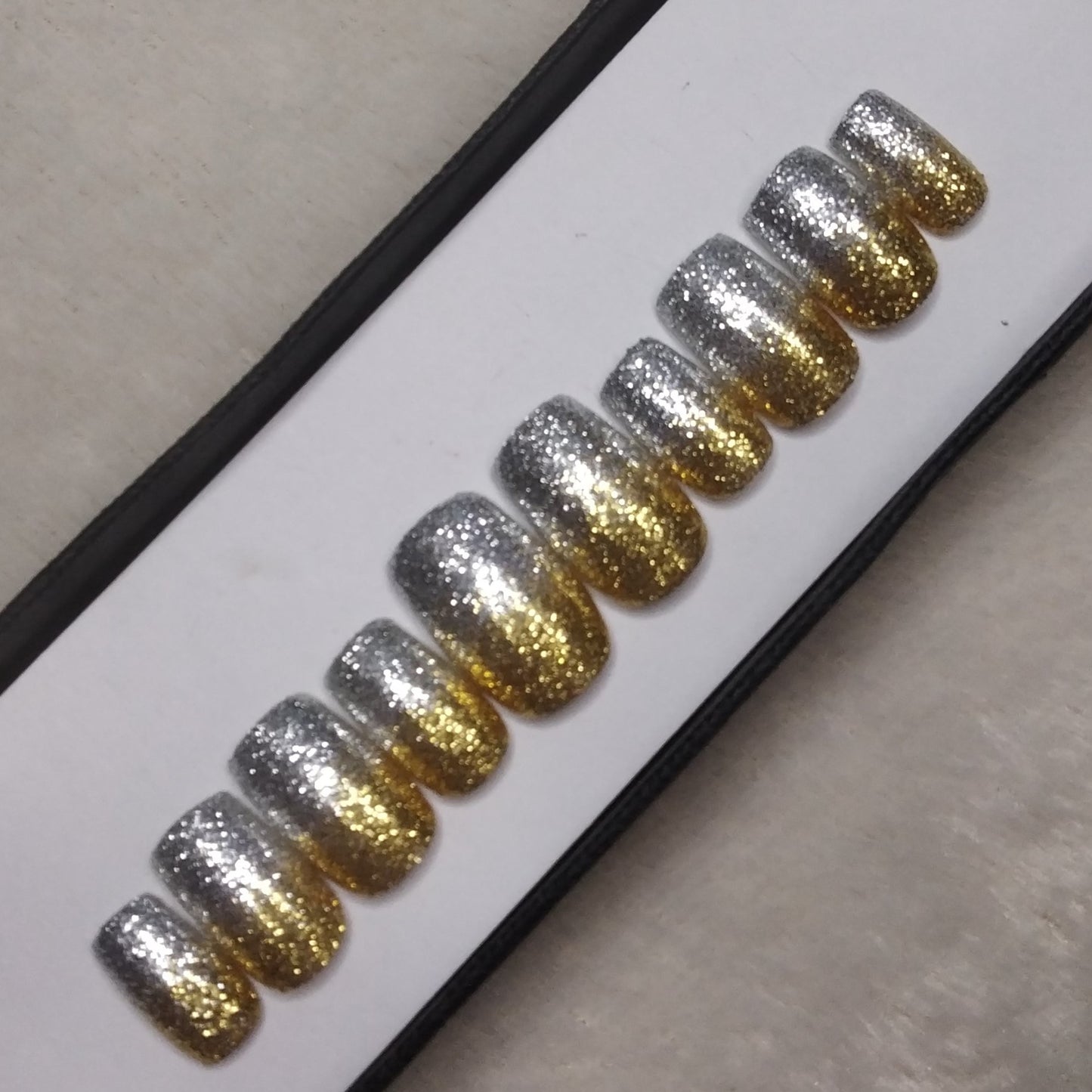 The NailzStation Glossy Silver and Golden Glitter Press on Fake Artificial Nails Set with glue, filer, sticker application kit // 1299