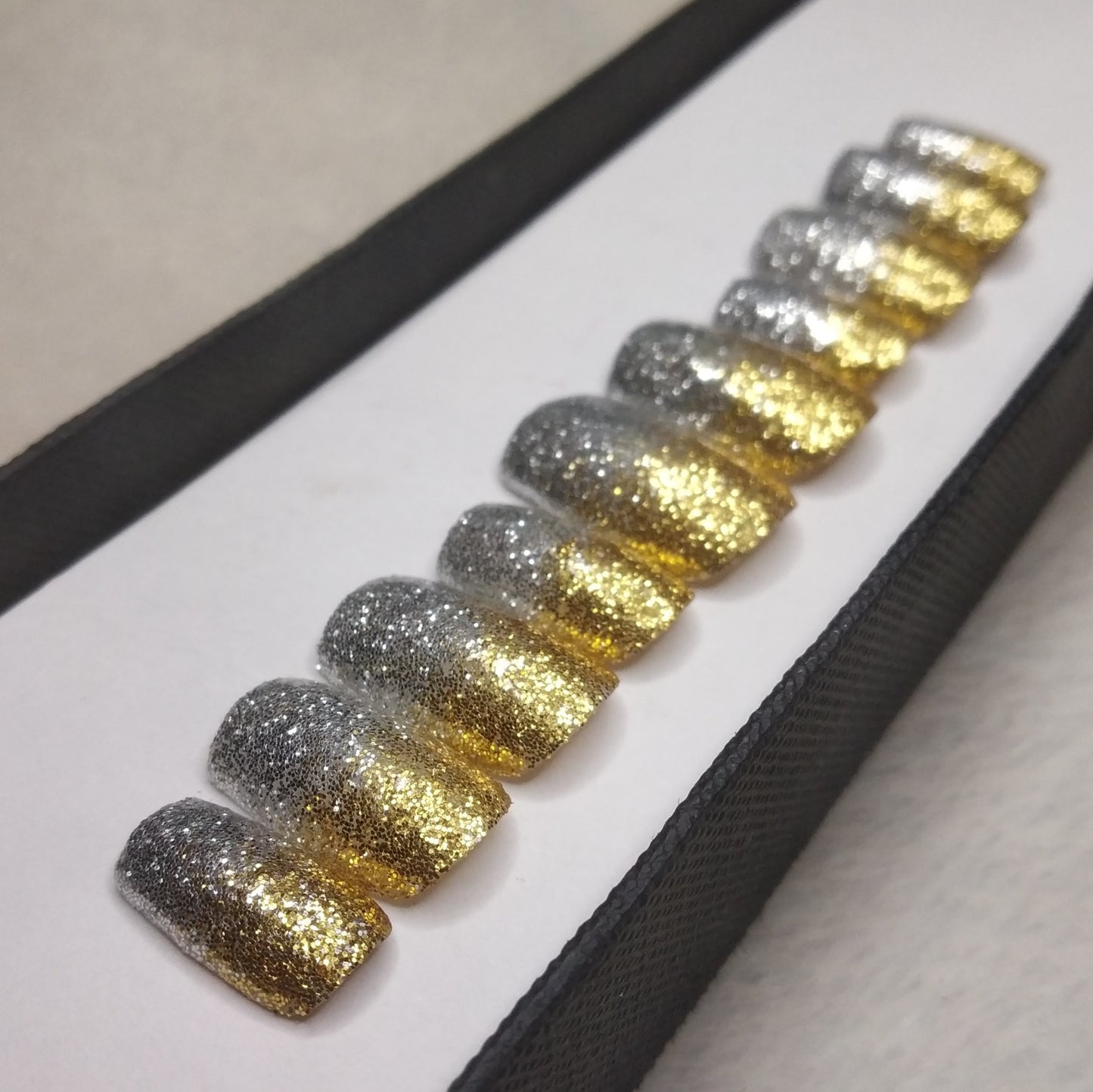 The NailzStation Glossy Silver and Golden Glitter Press on Fake Artificial Nails Set with glue, filer, sticker application kit // 1299