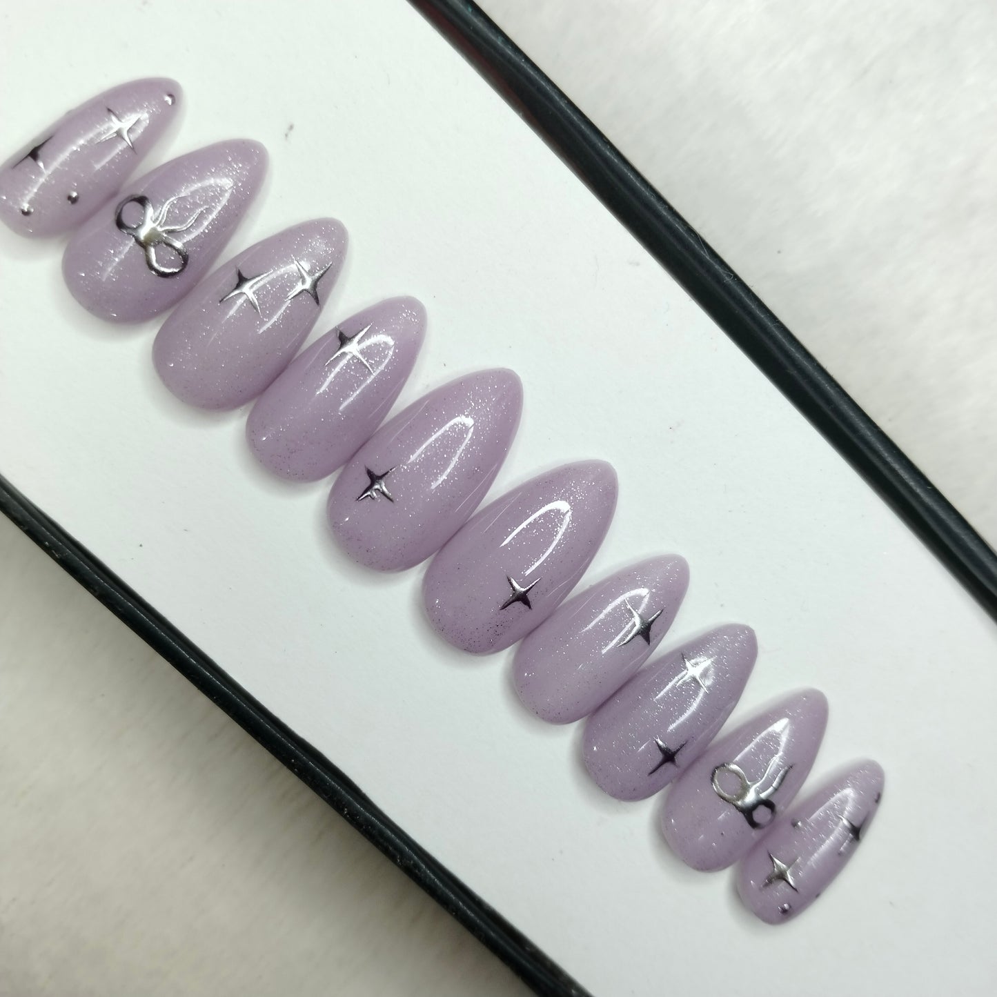 The NailzStation Glossy 3D Chrome Bow Press on Fake Artificial Nails Set with glue, filer, sticker application kit // 1220