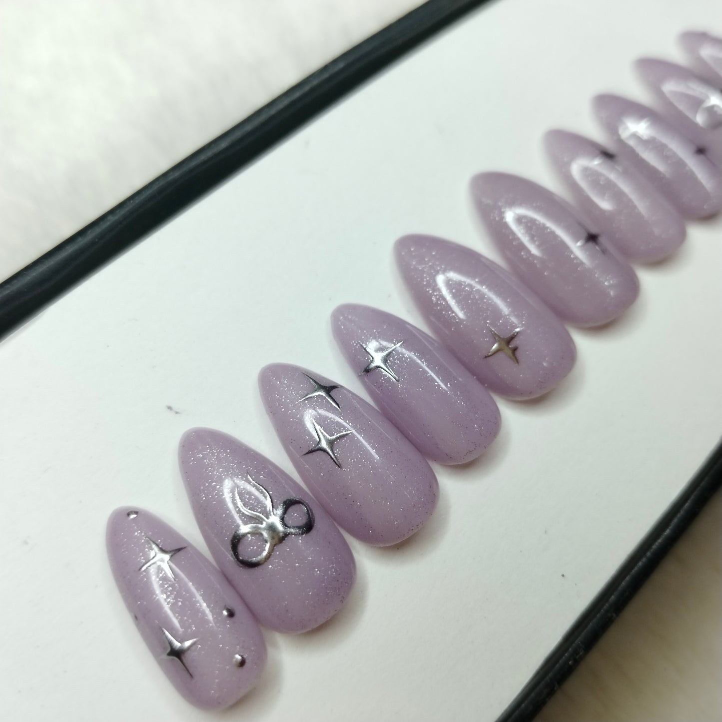 The NailzStation Glossy 3D Chrome Bow Press on Fake Artificial Nails Set with glue, filer, sticker application kit // 1220