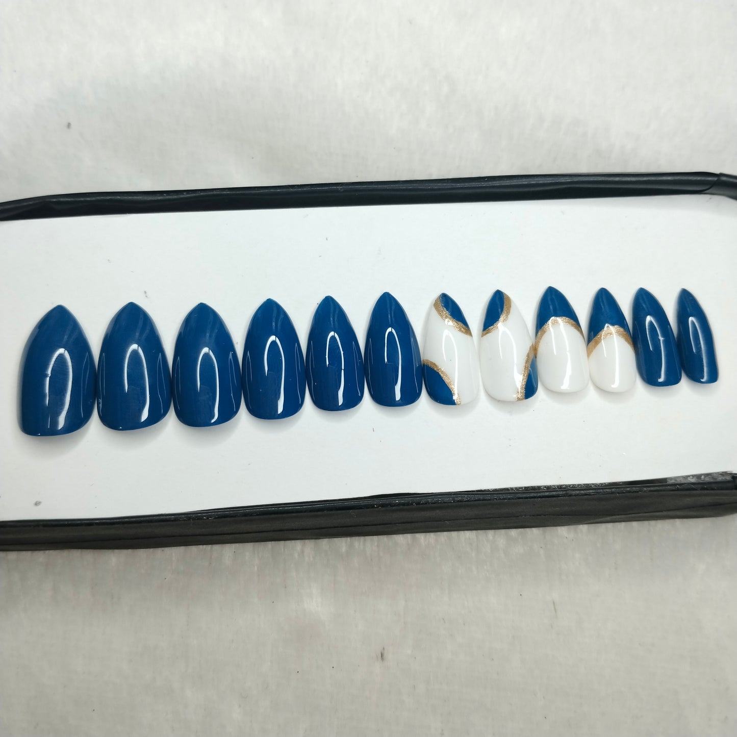 The NailzStation Glossy Blue Swirls Press on Fake Artificial Nails Set with glue, filer, sticker application kit // 1223