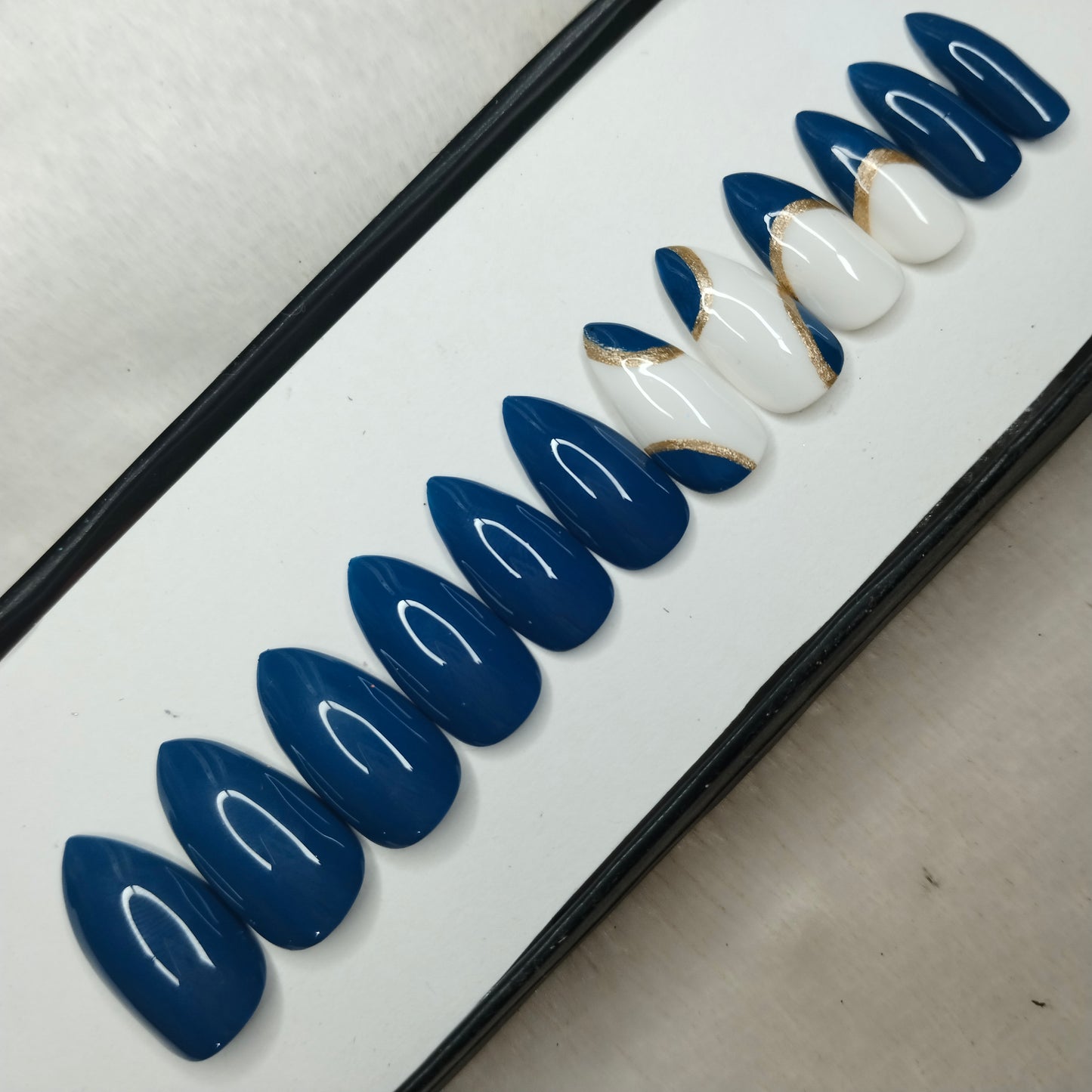 The NailzStation Glossy Blue Swirls Press on Fake Artificial Nails Set with glue, filer, sticker application kit // 1223