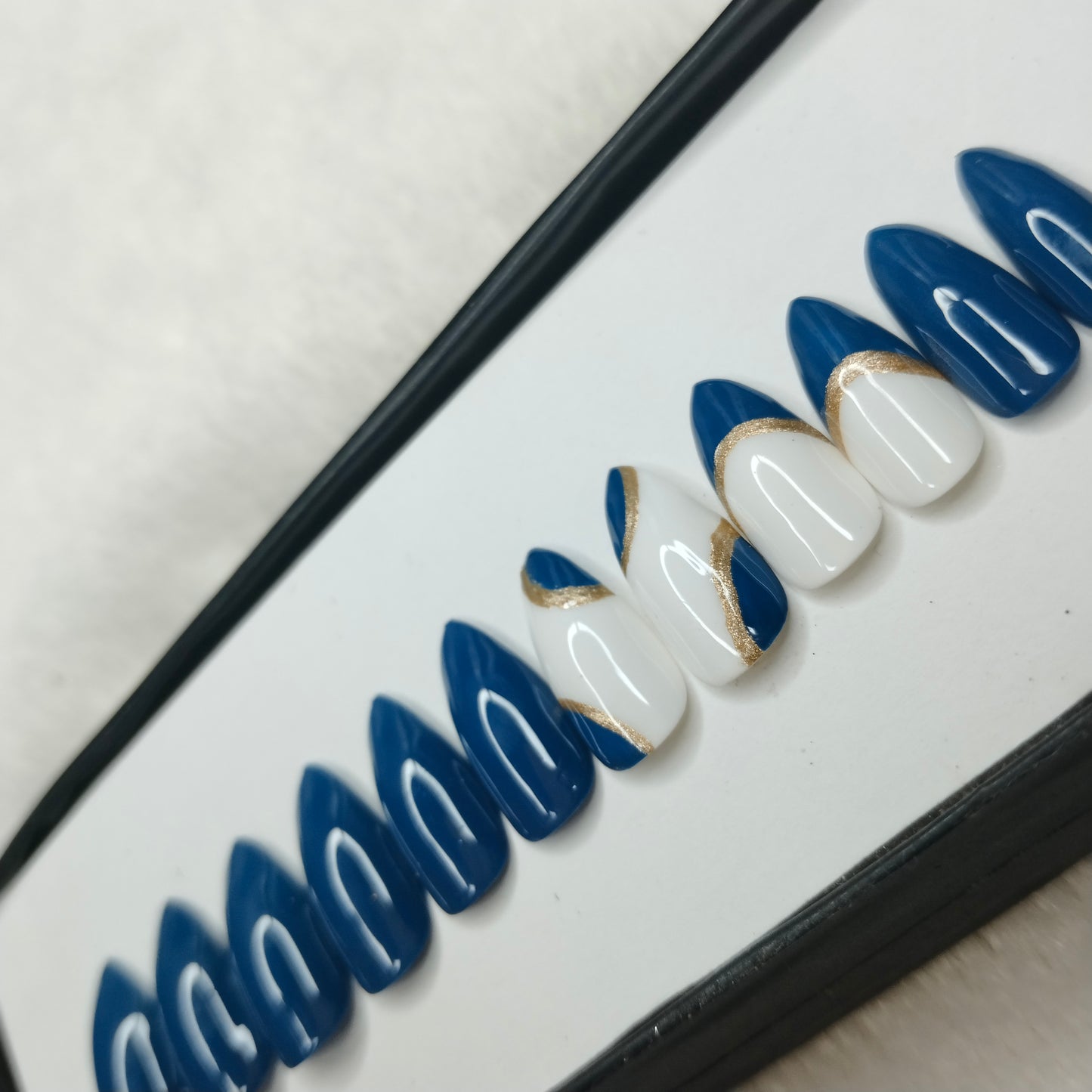 The NailzStation Glossy Blue Swirls Press on Fake Artificial Nails Set with glue, filer, sticker application kit // 1223