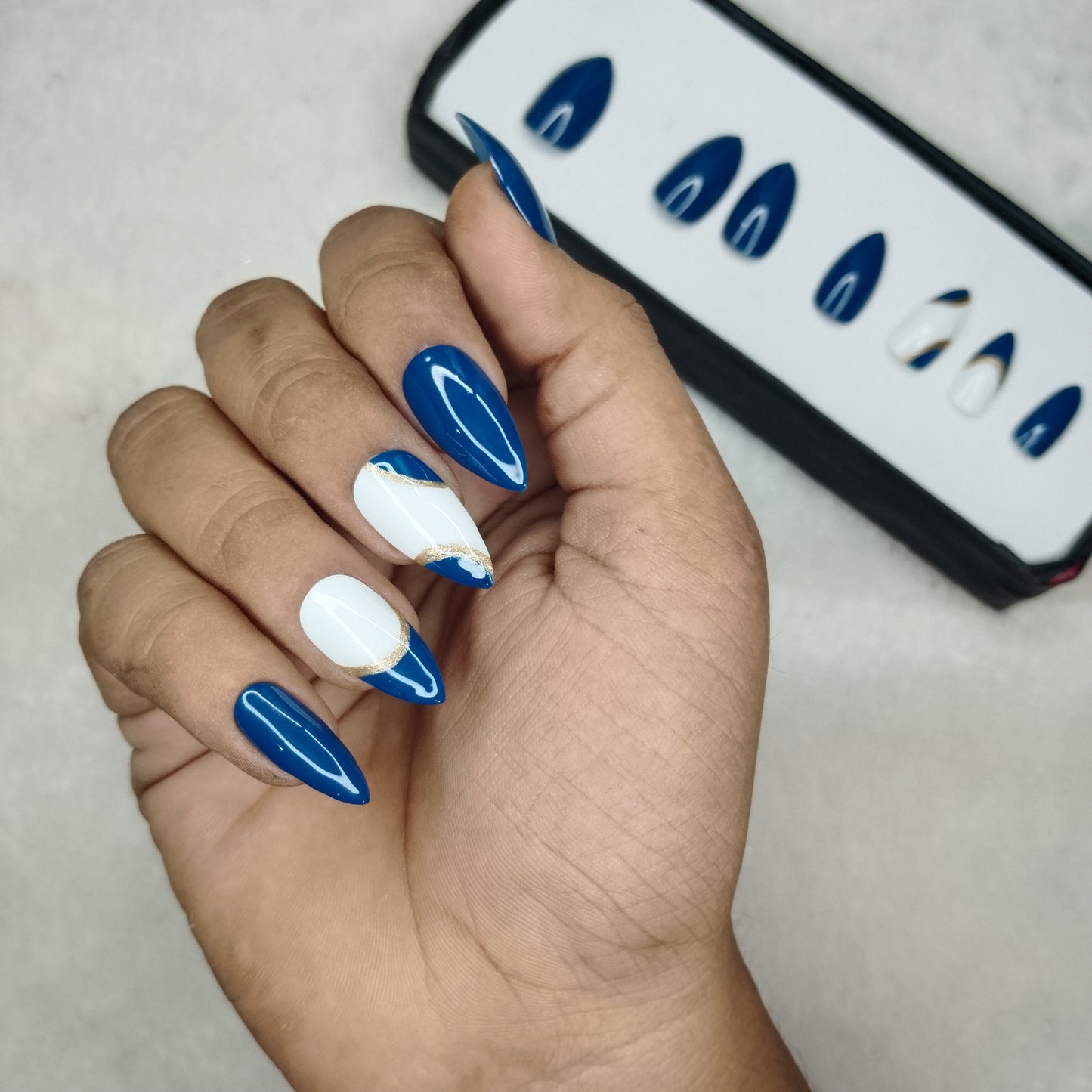 The NailzStation Glossy Blue Swirls Press on Fake Artificial Nails Set with glue, filer, sticker application kit // 1223