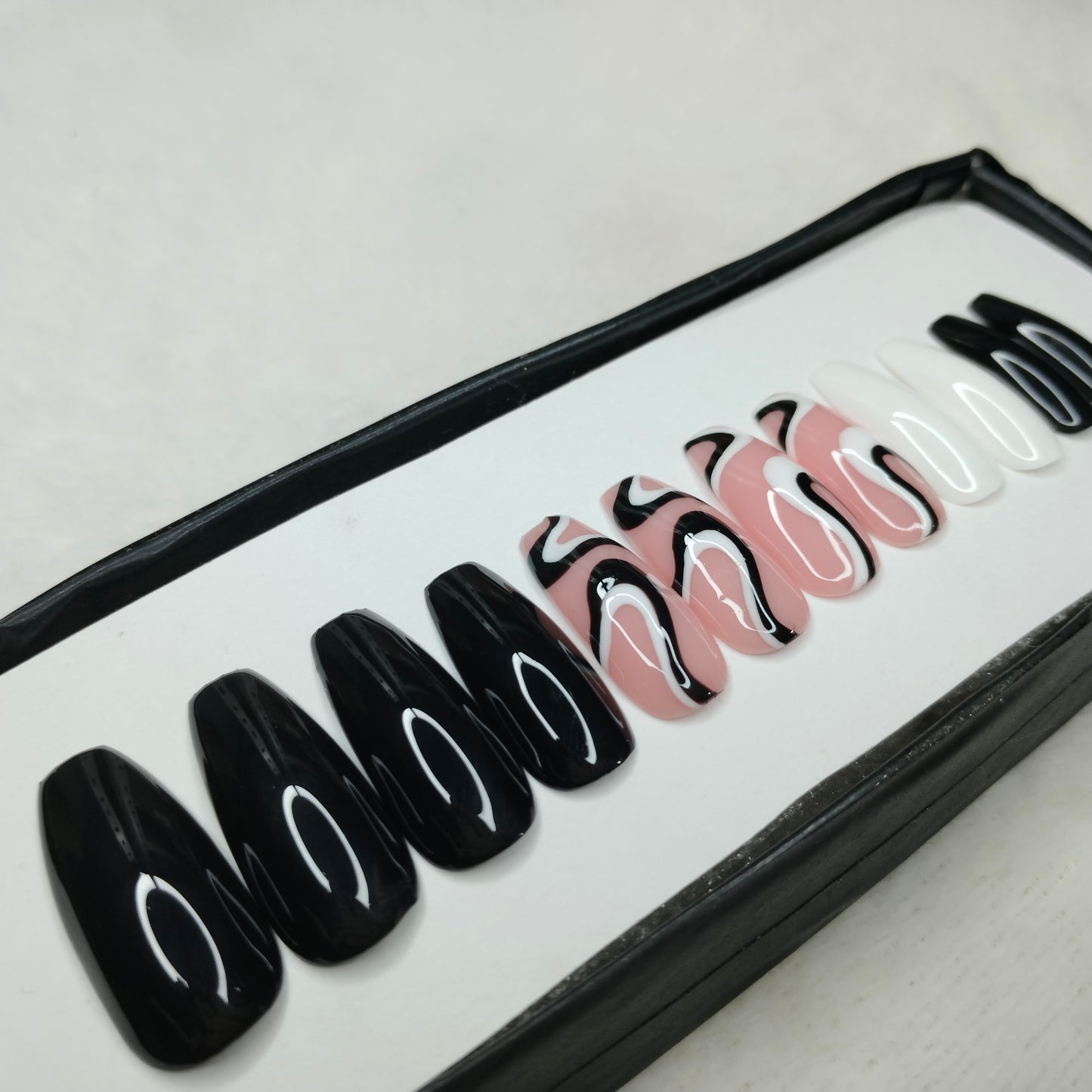 The NailzStation Glossy Black and White Swirls Press on Fake Artificial Nails Set with glue, filer, sticker application kit // 1235