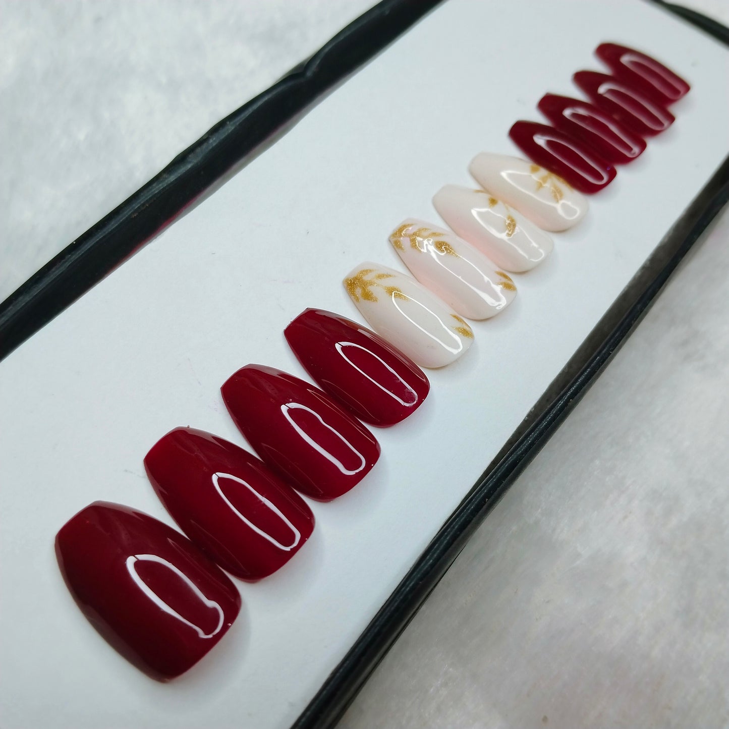 The NailzStation Glossy Maroon Glitter Leaves Press on Fake Artificial Nails Set with glue, filer, sticker application kit // 1265