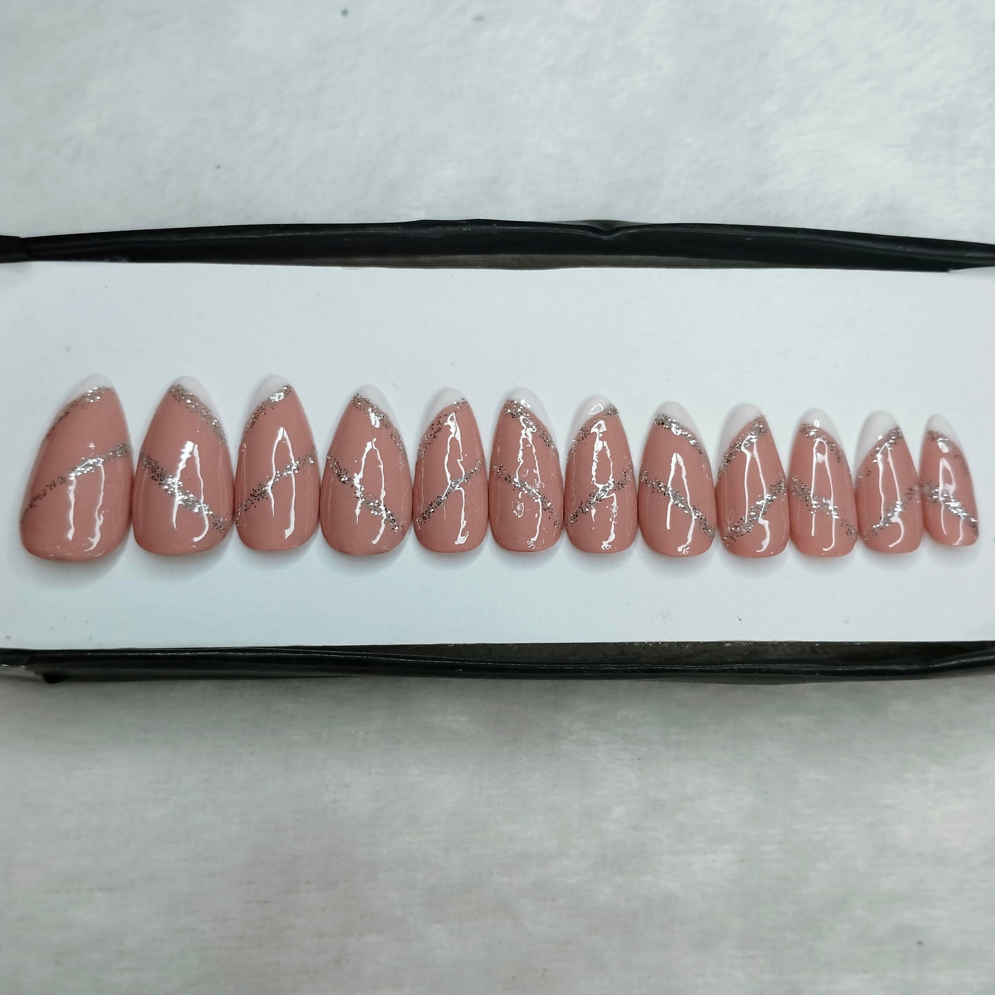 The NailzStation Glossy Nude Glitter Swirls Press on Fake Artificial Nails Set with glue, filer, sticker application kit // 1260