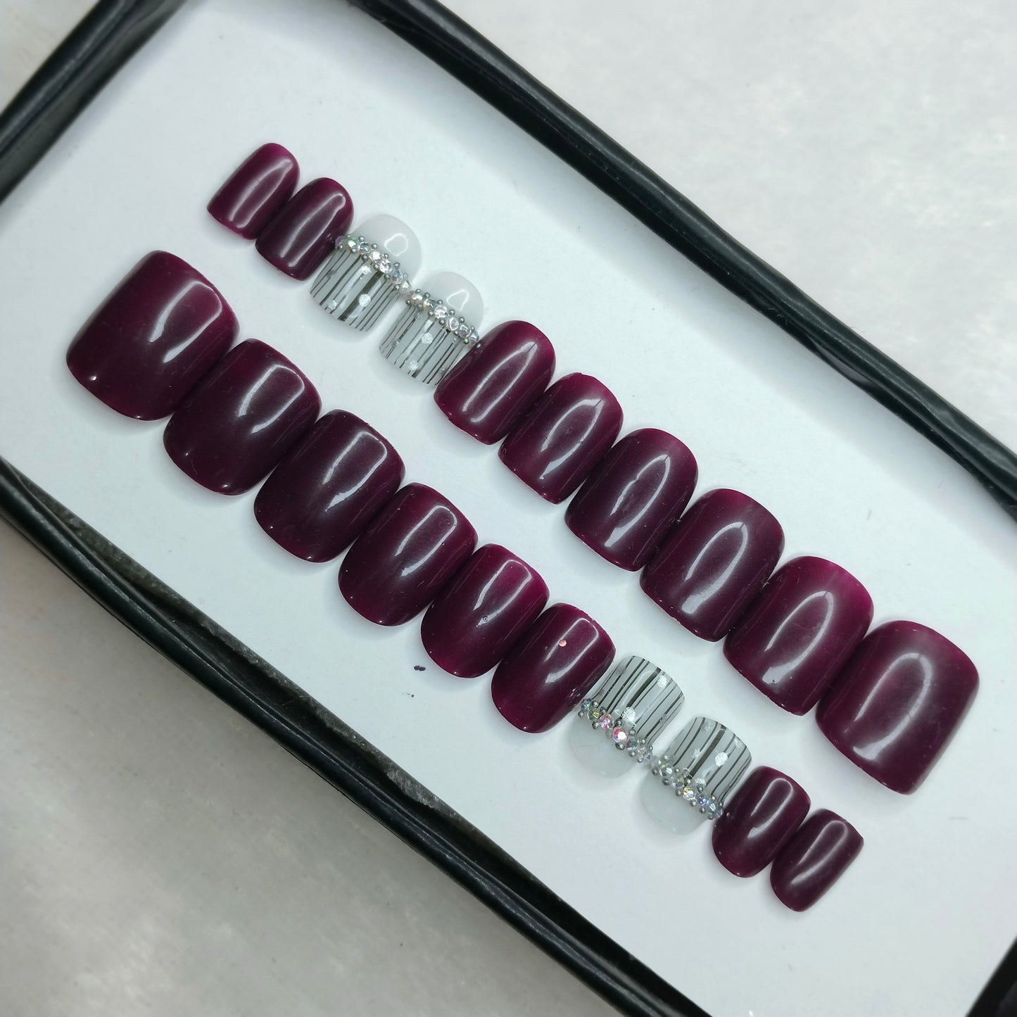 The NailzStation Glossy Plum Studded Press on Fake Artificial Nails Set with glue, filer, sticker application kit // 1256