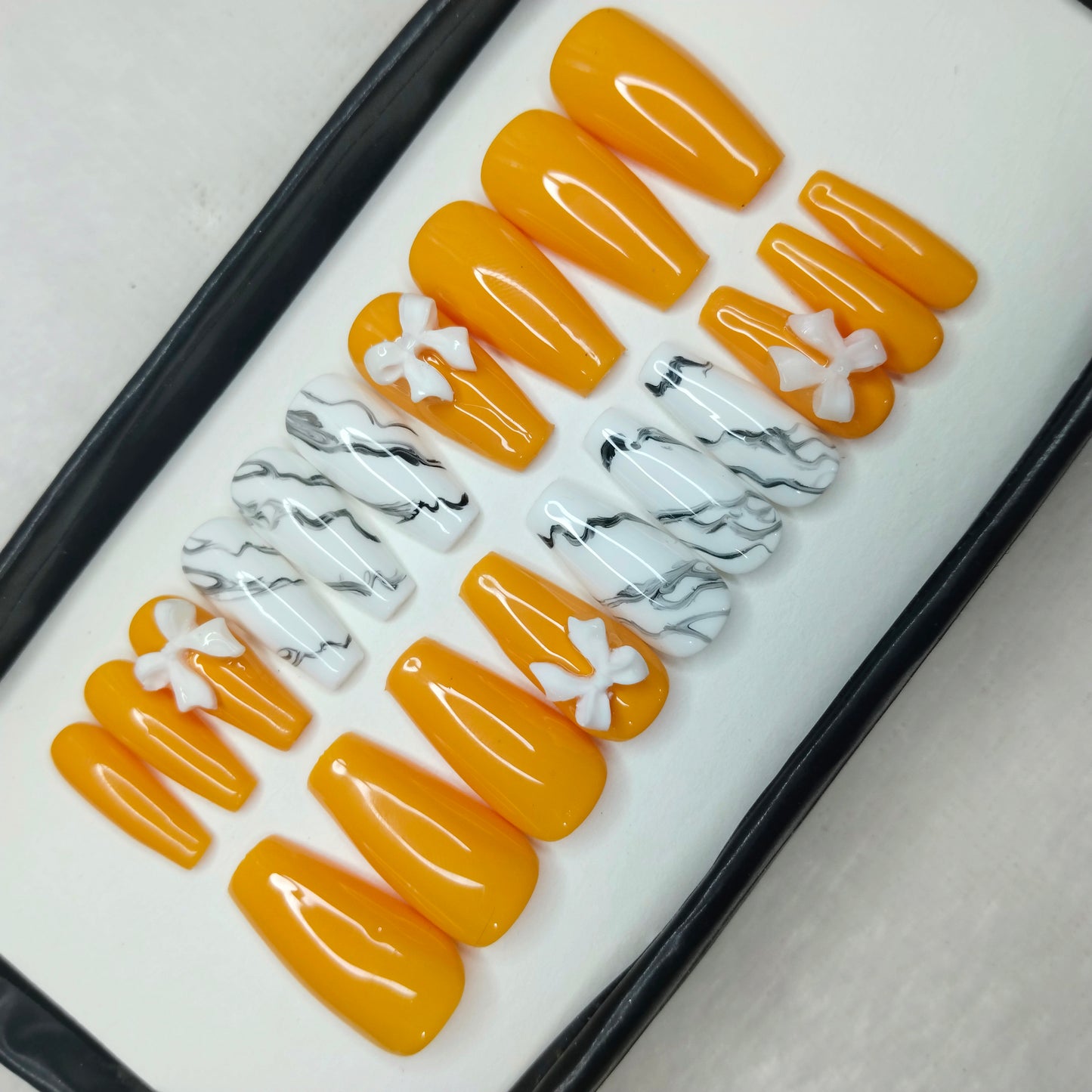 The NailzStation Glossy Yellow Marble 3D Bow Press on Fake Artificial Nails Set with glue, filer, sticker application kit // 1422