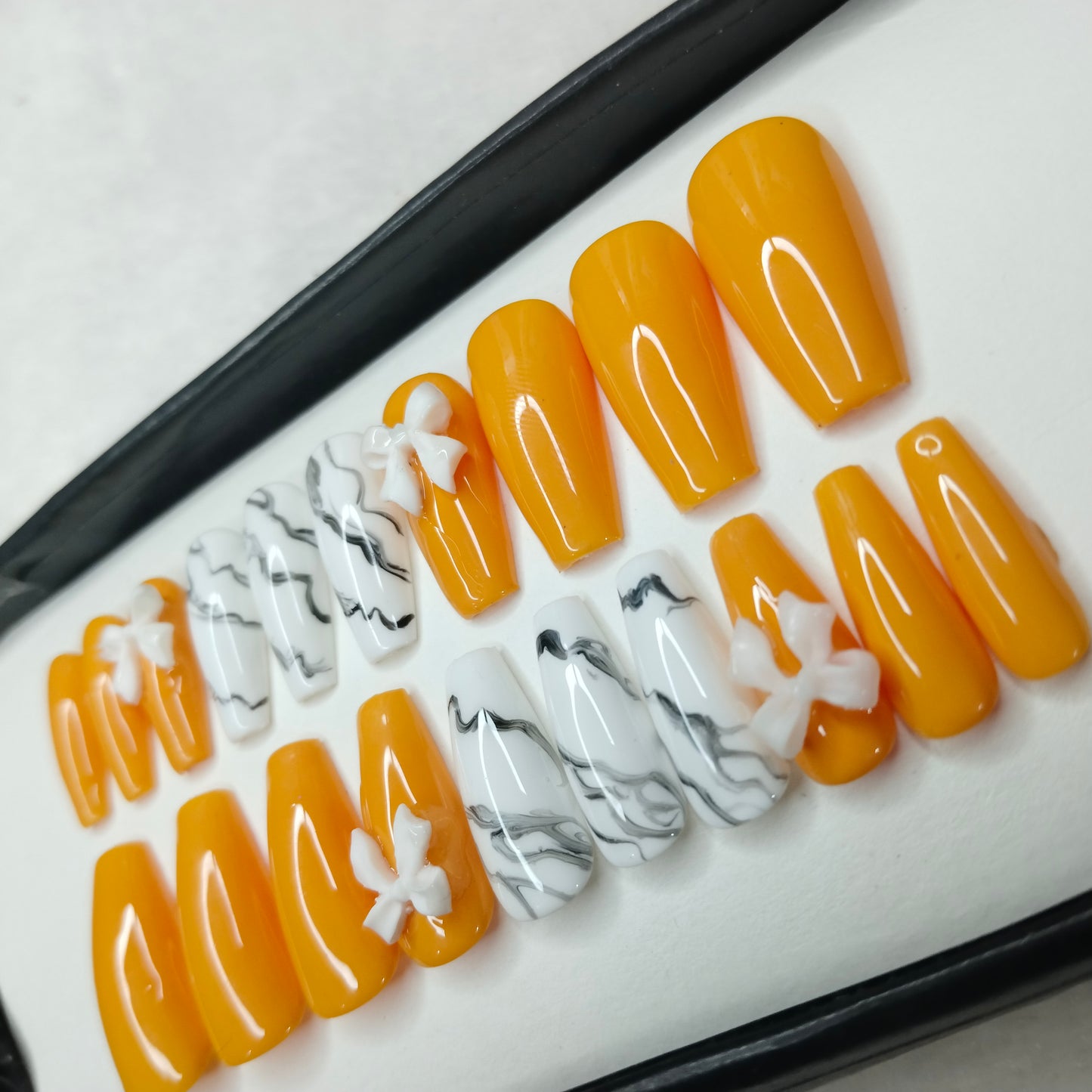 The NailzStation Glossy Yellow Marble 3D Bow Press on Fake Artificial Nails Set with glue, filer, sticker application kit // 1422