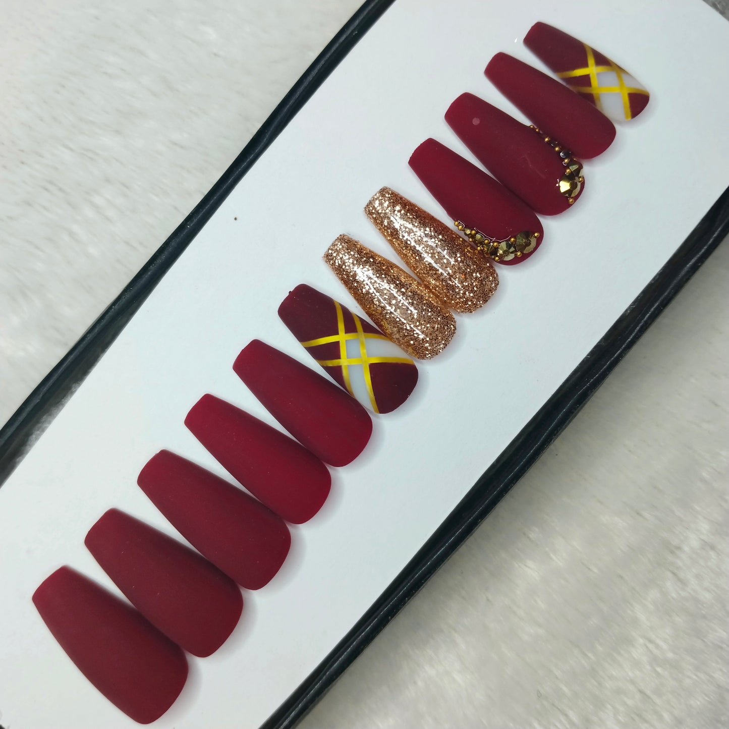 The NailzStation Matte Maroon Glitter Studded Press on Fake Artificial Nails Set with glue, filer, sticker application kit // 1423