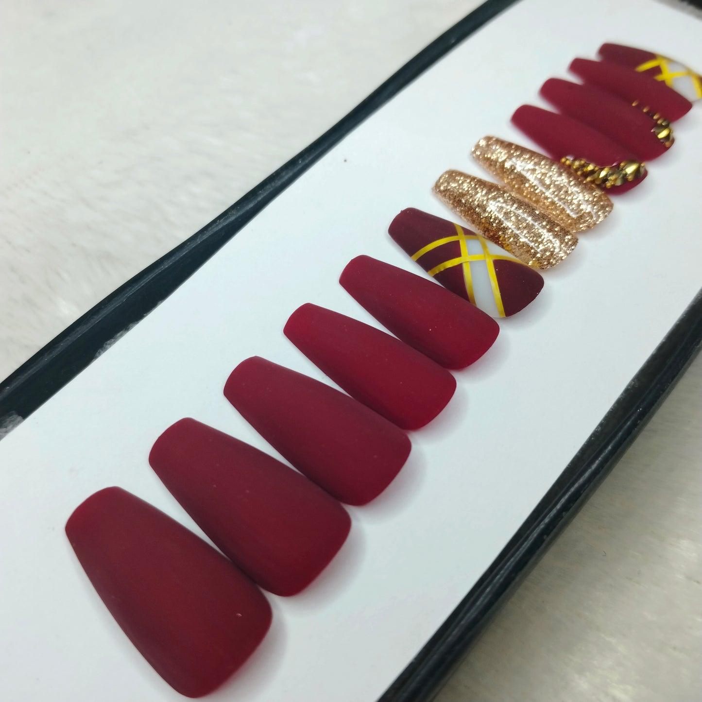 The NailzStation Matte Maroon Glitter Studded Press on Fake Artificial Nails Set with glue, filer, sticker application kit // 1423