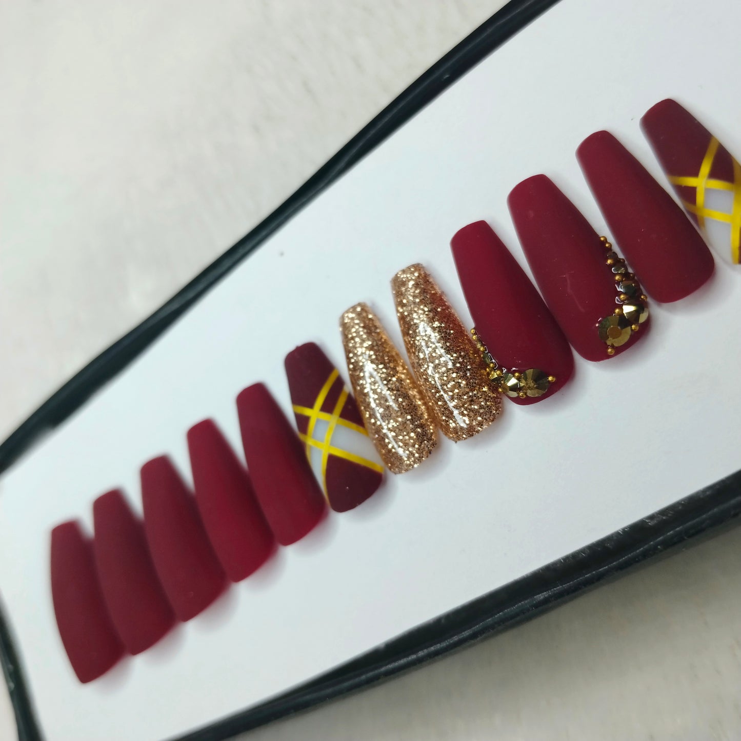 The NailzStation Matte Maroon Glitter Studded Press on Fake Artificial Nails Set with glue, filer, sticker application kit // 1423