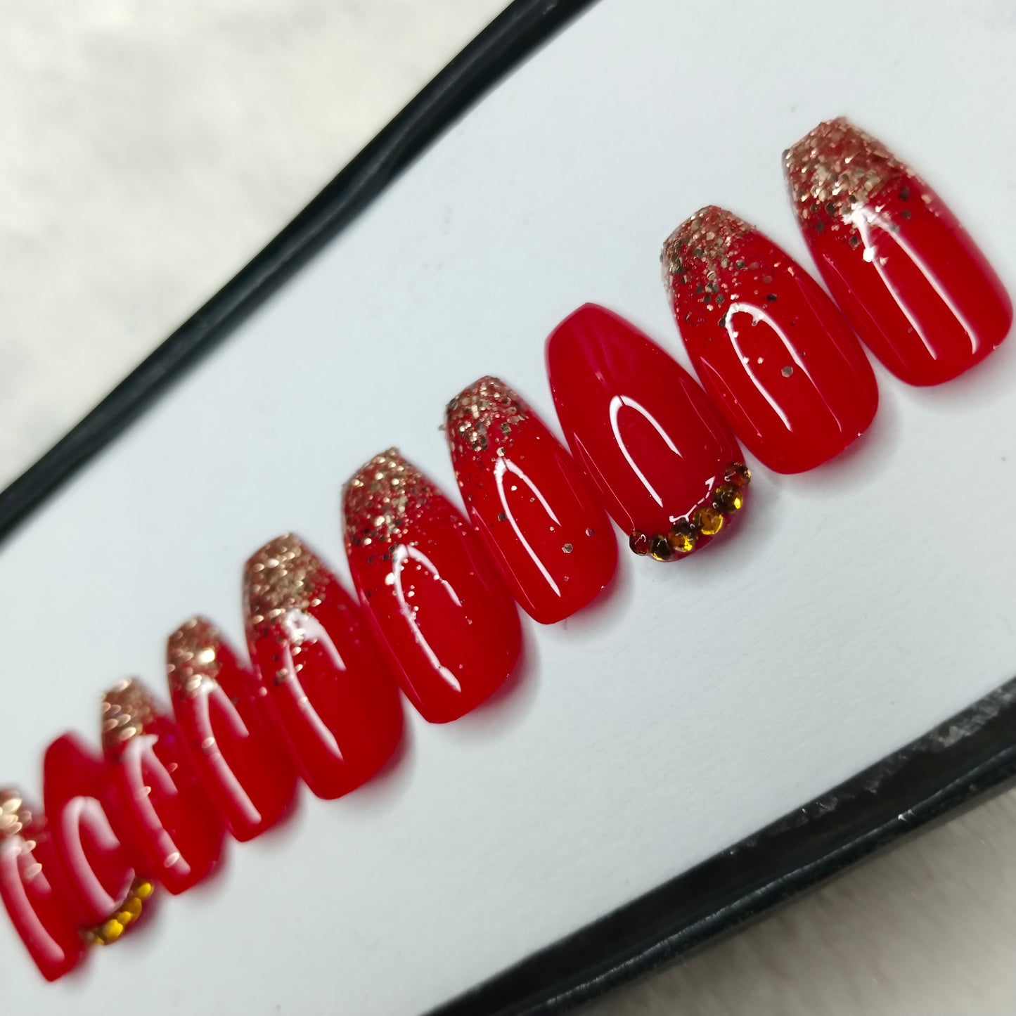 The NailzStation Glossy Red Glitter Studded Press on Fake Artificial Nails Set with glue, filer, sticker application kit // 1417