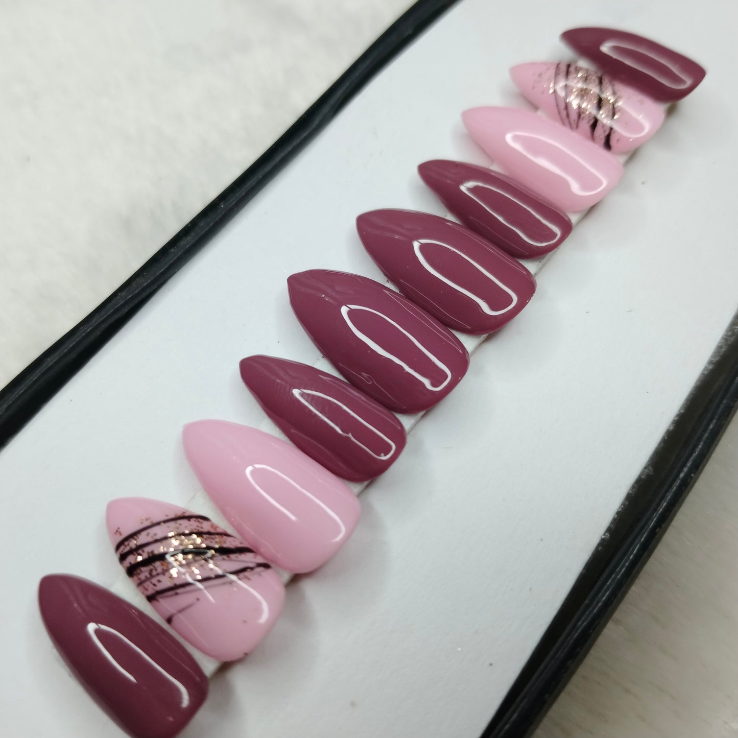 The NailzStation Glossy Pink Swirls Press on Fake Artificial Nails Set with glue, filer, sticker application kit // 1410