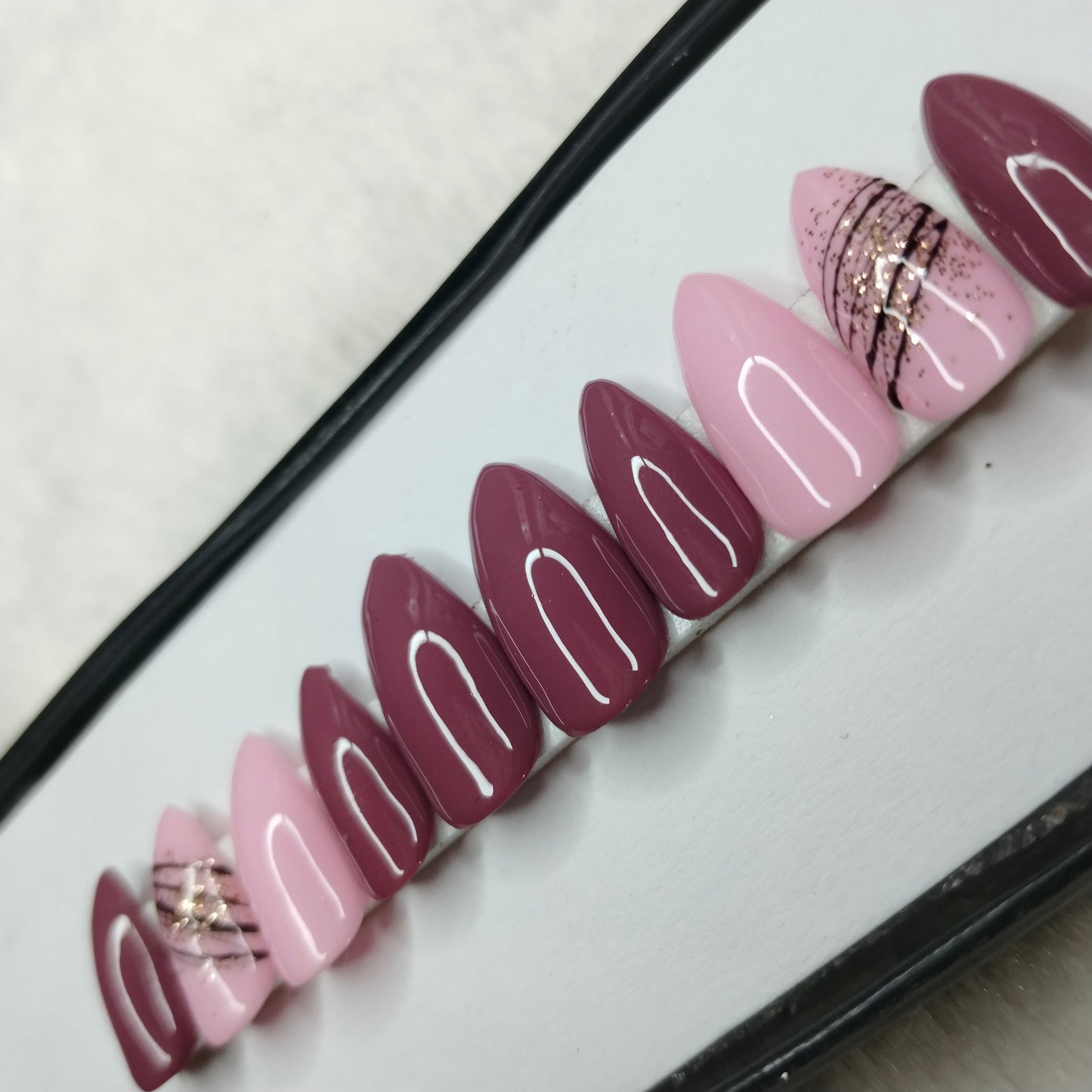 The NailzStation Glossy Pink Swirls Press on Fake Artificial Nails Set with glue, filer, sticker application kit // 1410