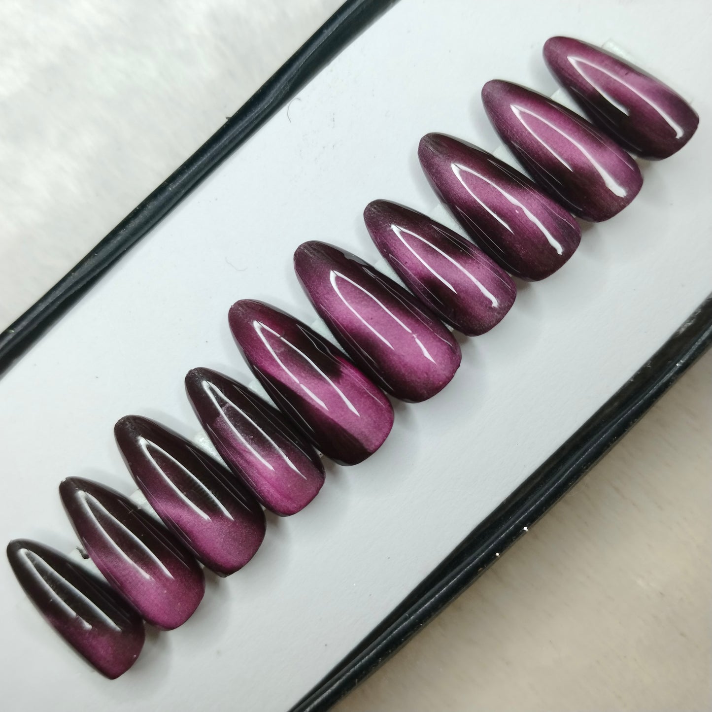 The NailzStation Glossy Pink Cat Eye Press on Fake Artificial Nails Set with glue, filer, sticker application kit // 1409