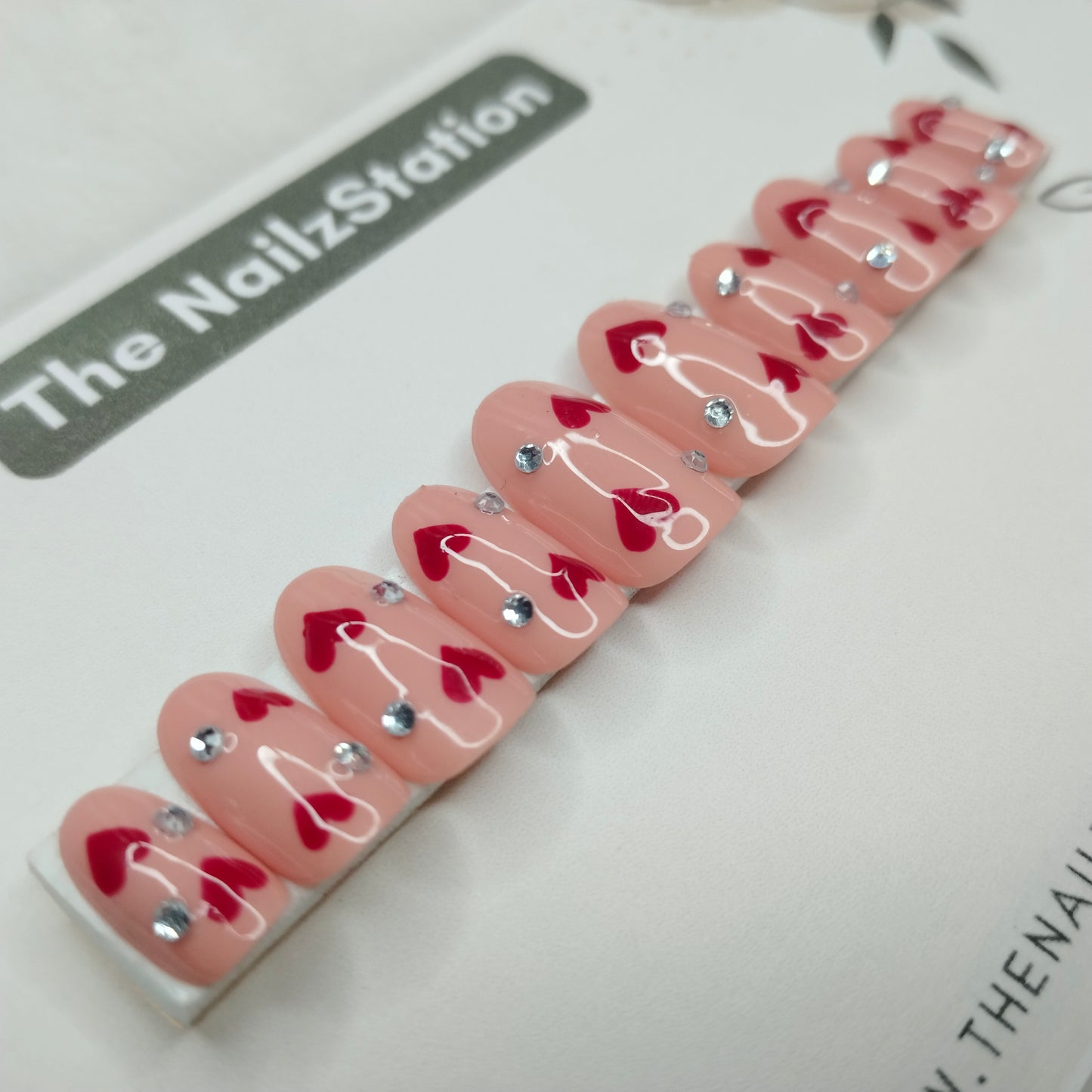 The NailzStation Glossy Nude Studded Hearts Press on Fake Artificial Nails Set with glue, filer, sticker application kit // 1405