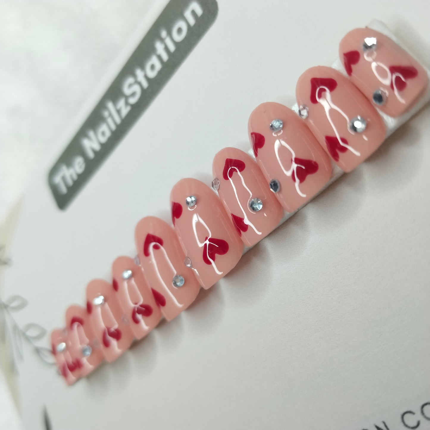 The NailzStation Glossy Nude Studded Hearts Press on Fake Artificial Nails Set with glue, filer, sticker application kit // 1405