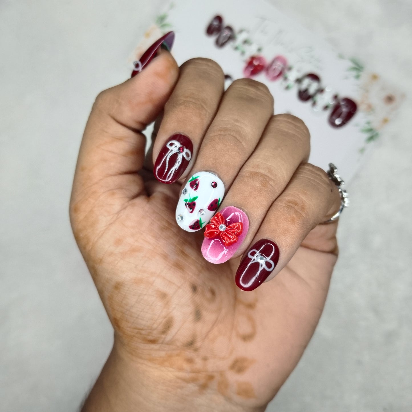 The NailzStation Glossy Maroon 3D Bow Press on Fake Artificial Nails Set with glue, filer, sticker application kit // 1400