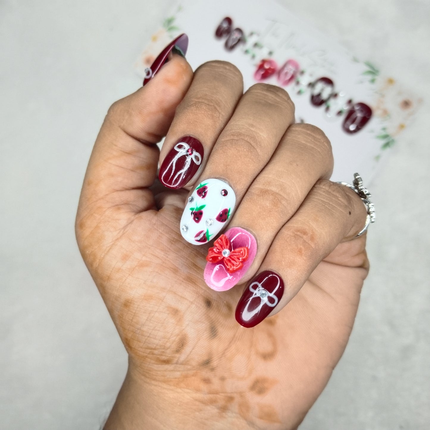 The NailzStation Glossy Maroon 3D Bow Press on Fake Artificial Nails Set with glue, filer, sticker application kit // 1400