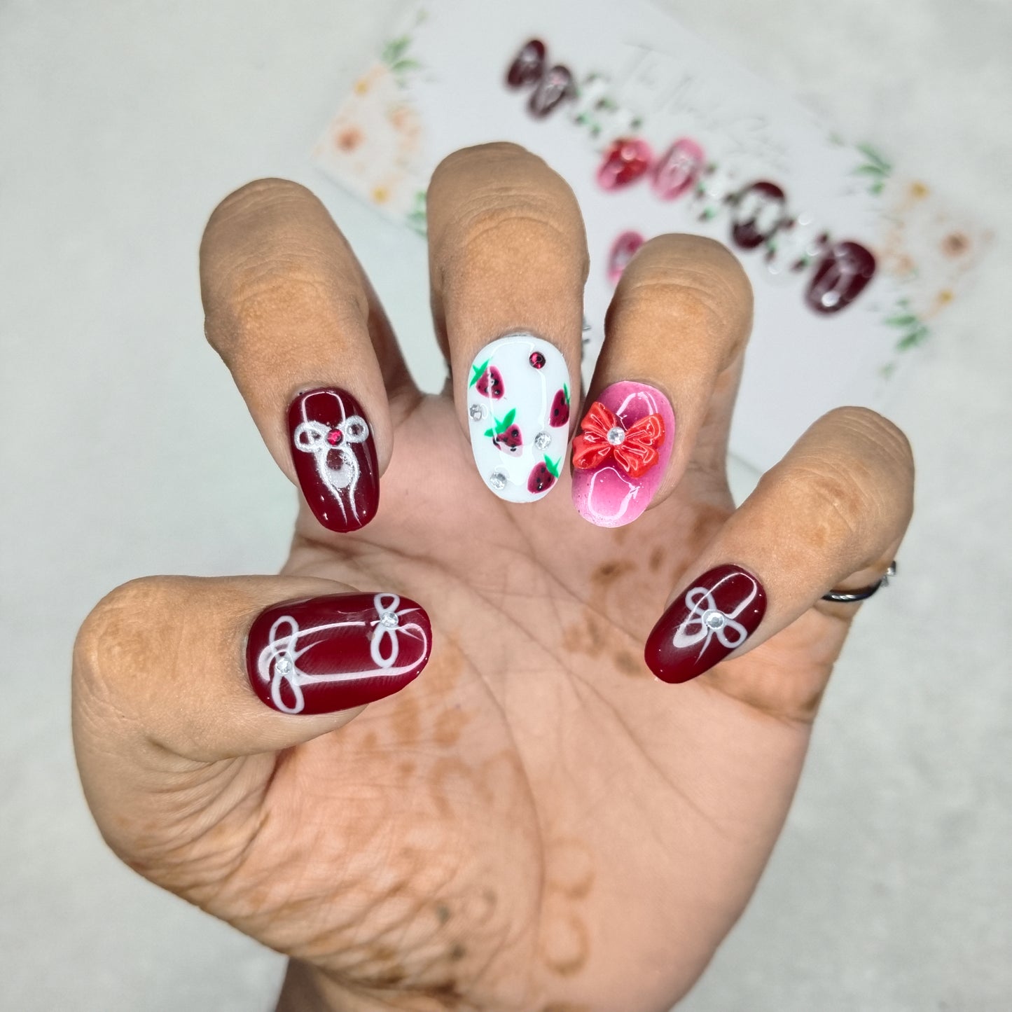 The NailzStation Glossy Maroon 3D Bow Press on Fake Artificial Nails Set with glue, filer, sticker application kit // 1400