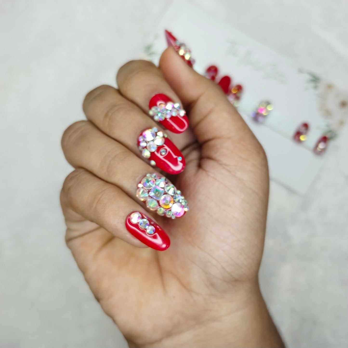 The NailzStation Glossy Red Studded Press on Fake Artificial Nails Set with glue, filer, sticker application kit // 1396