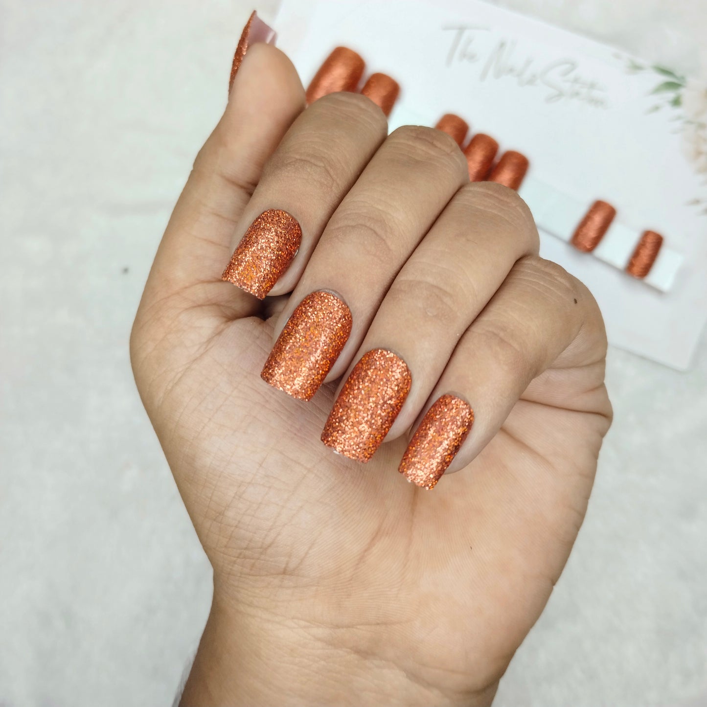 The NailzStation Glossy Orange Glitter Press on Fake Artificial Nails Set with glue, filer, sticker application kit // 1482