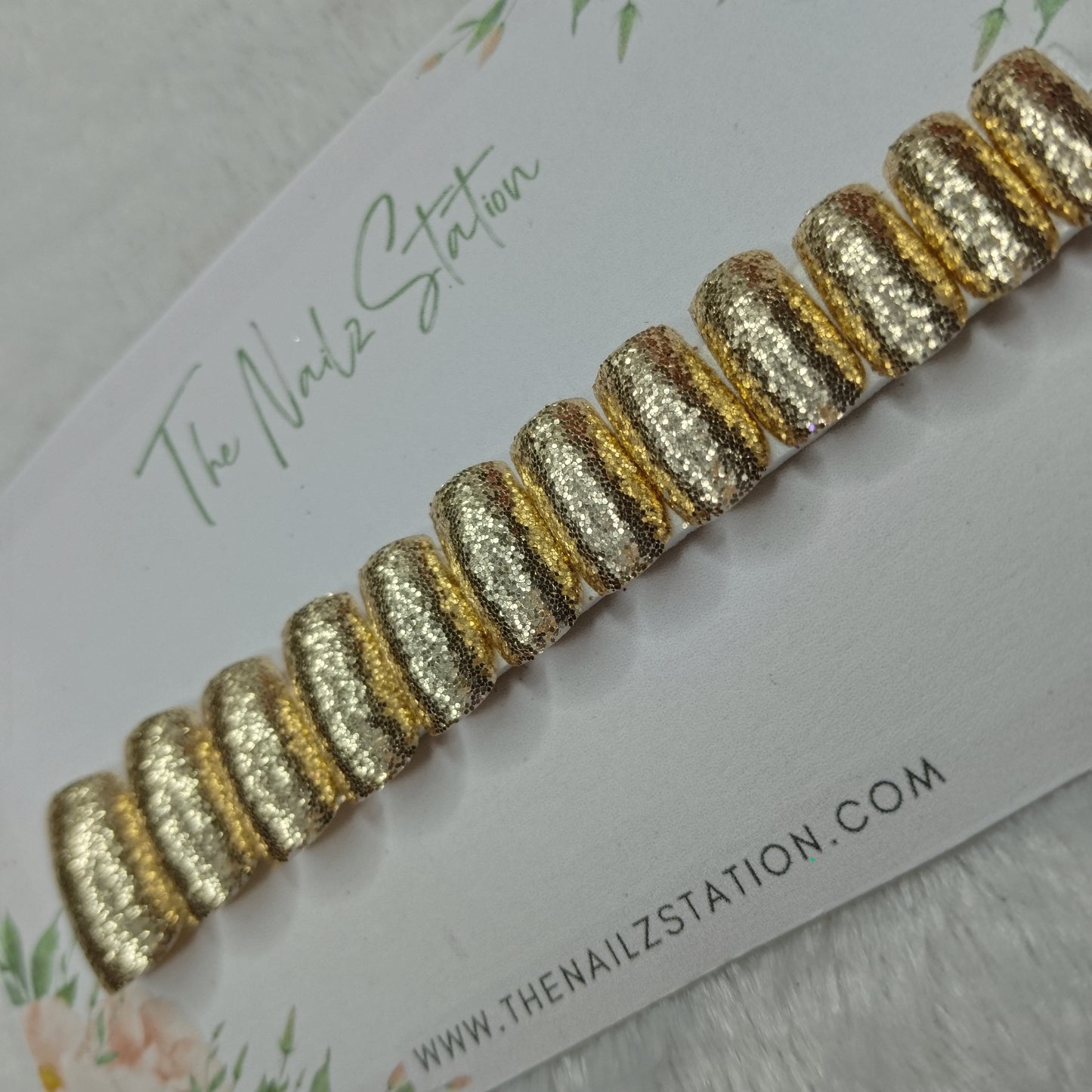 The NailzStation Glossy Golden Glitter Press on Fake Artificial Nails Set with glue, filer, sticker application kit // 1494