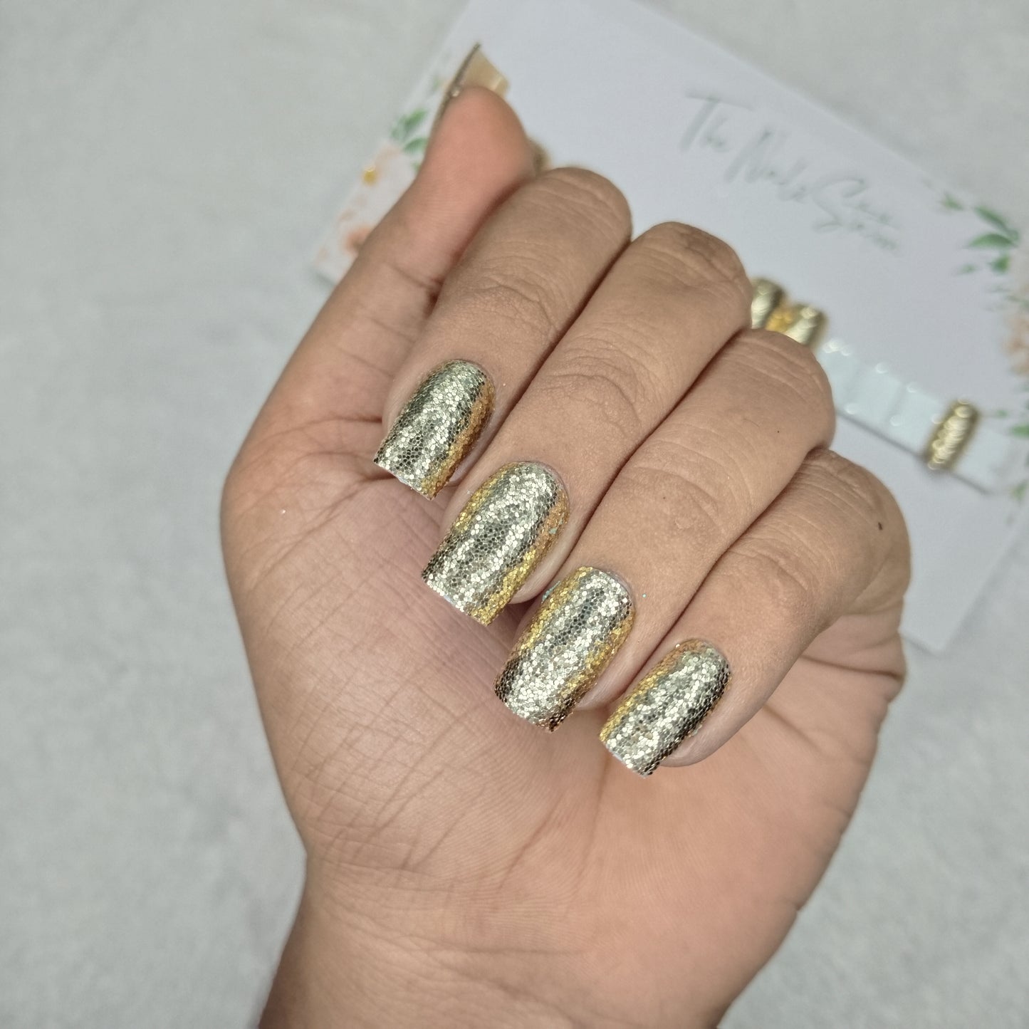 The NailzStation Glossy Golden Glitter Press on Fake Artificial Nails Set with glue, filer, sticker application kit // 1494