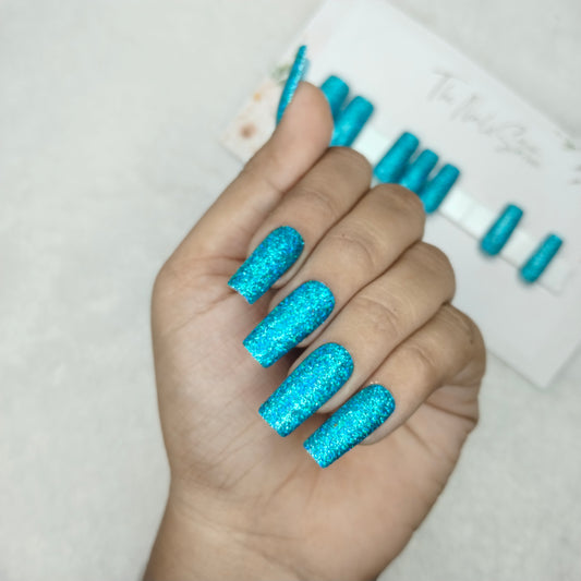 The NailzStation Glossy Light Blue Glitter Press on Fake Artificial Nails Set with glue, filer, sticker application kit // 1501