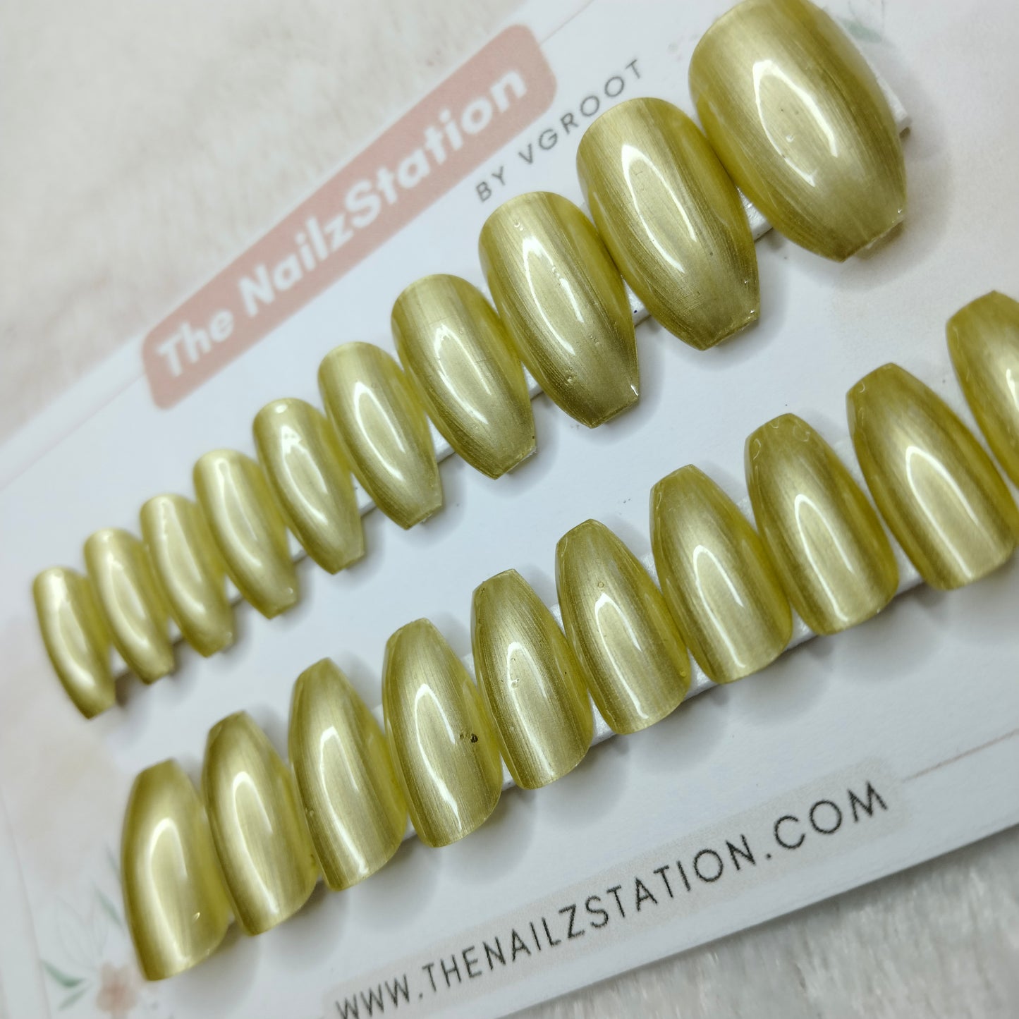 The NailzStation Glossy Gold Chrome Press on Fake Artificial Nails Set with glue, filer, sticker application kit // 1509